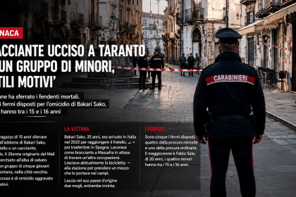 Carabiniere di spalle davanti alla scena del crimine nel centro storico di Taranto dopo l’omicidio del bracciante Bakari Sako
